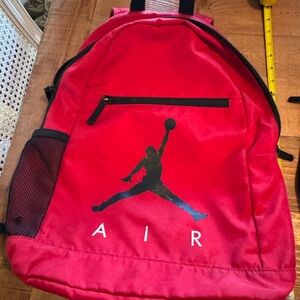 Air Jordan Red Backpack with Iconic Logo & small zipper pouch.